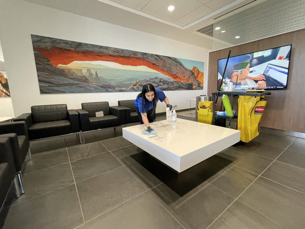 ROC Commercial Cleaning | Woman cleaning the customer waiting area