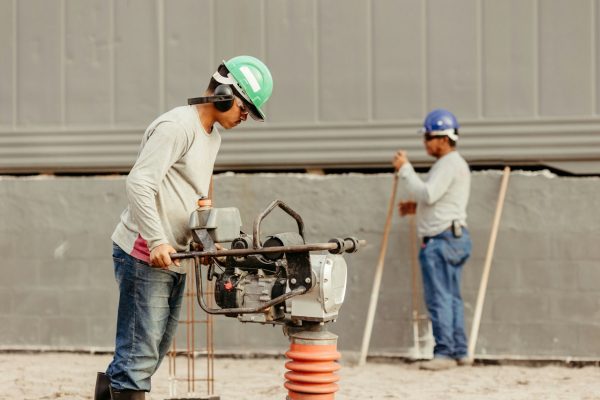 a couple of men working at a construction site