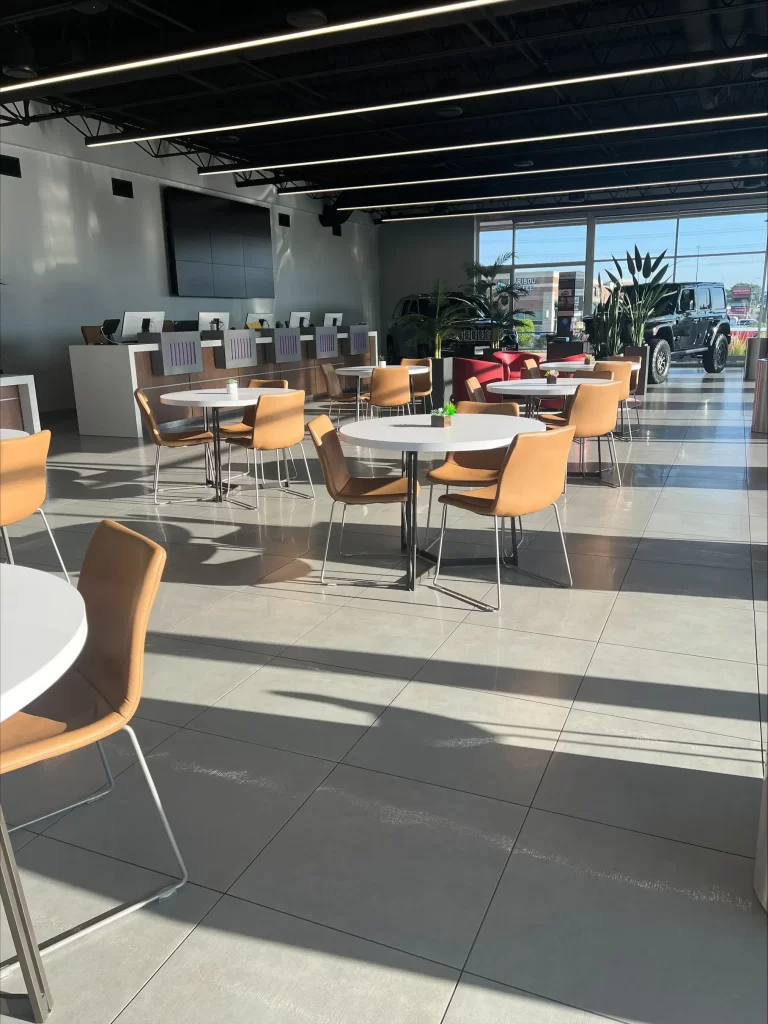 a clean area with tables and chairs