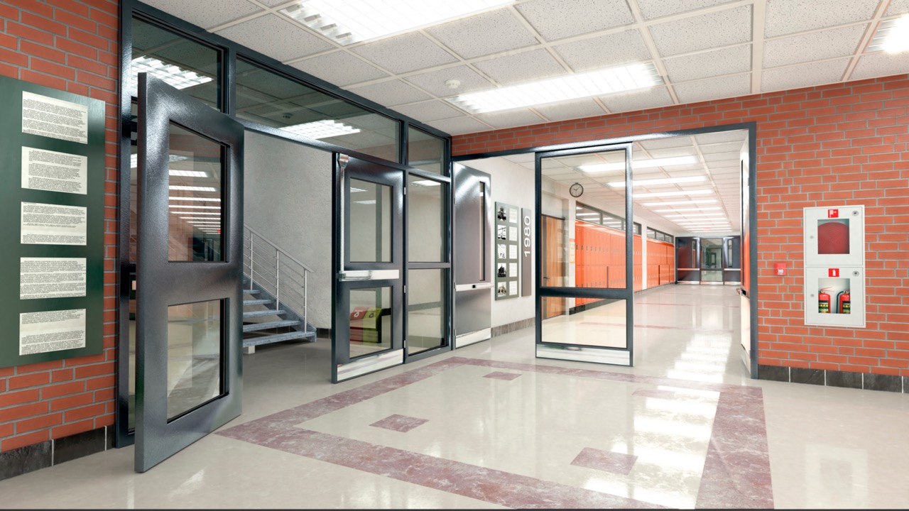 School hallway with brick walls, open doors and clean floors